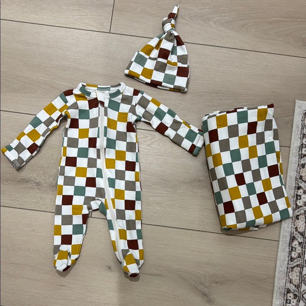 Spearmint Love “Cannoli Checkerboard” infant footie.